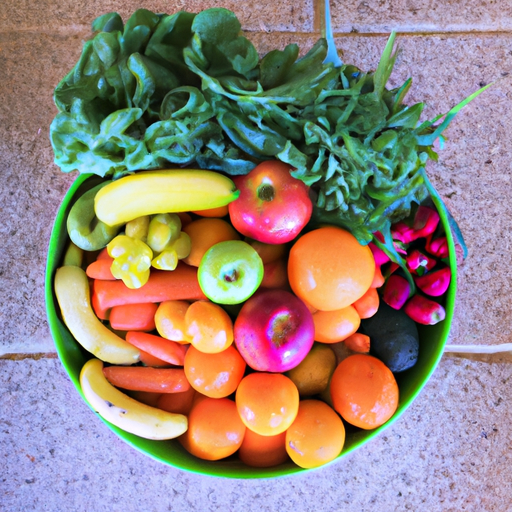 A bowl of ripe, colorful fruits and vegetables arranged in a spiral pattern.