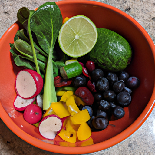 A colorful bowl filled with a variety of healthy fruits and vegetables.